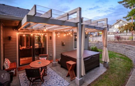Bellingham Custom Pergola closer view from retaining wall | True Bearing Built