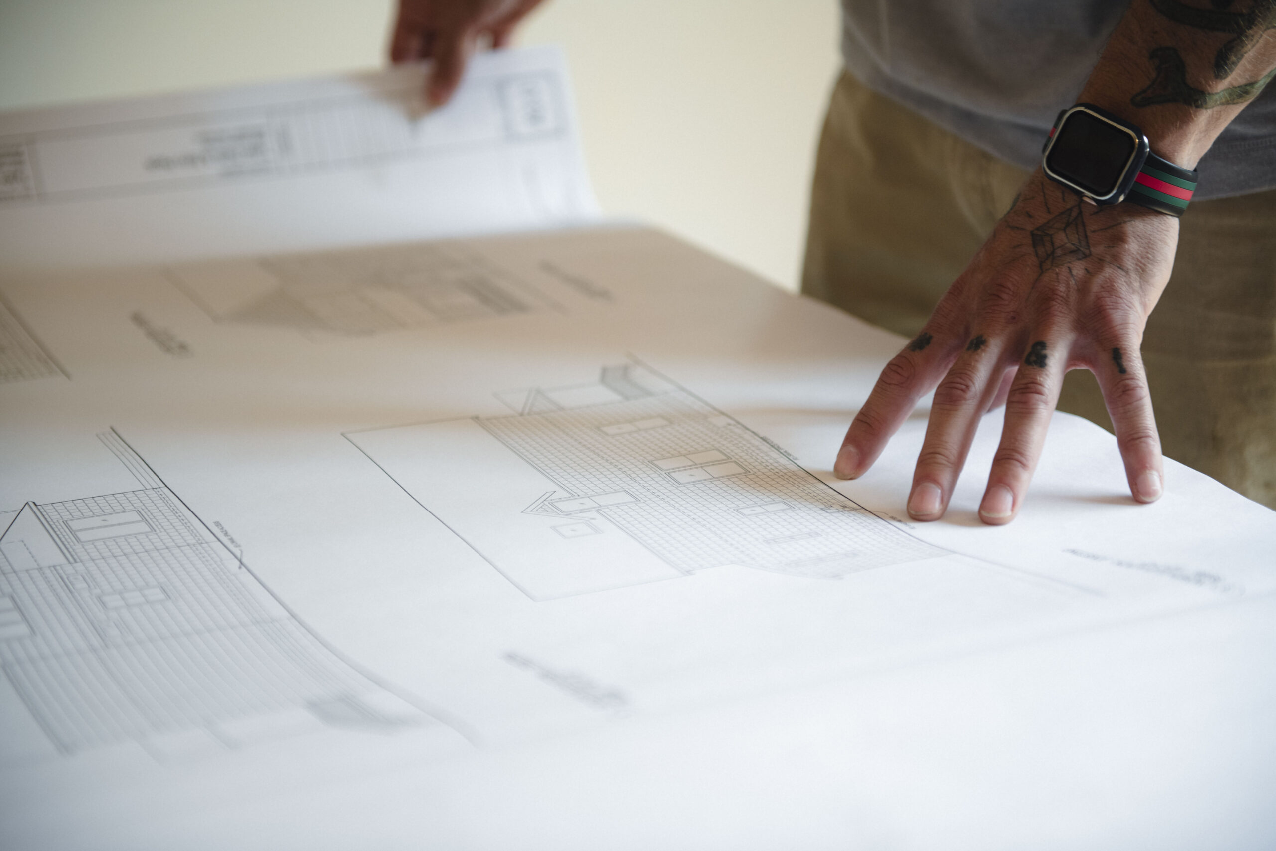 A site lead looks over plans for a remodel in Bellingham.